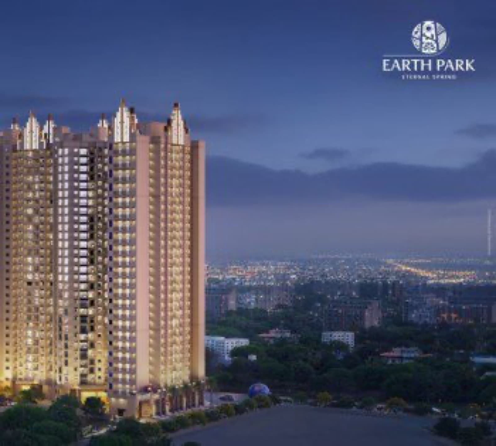 Earth Park towers glowing over Kalyan at dusk